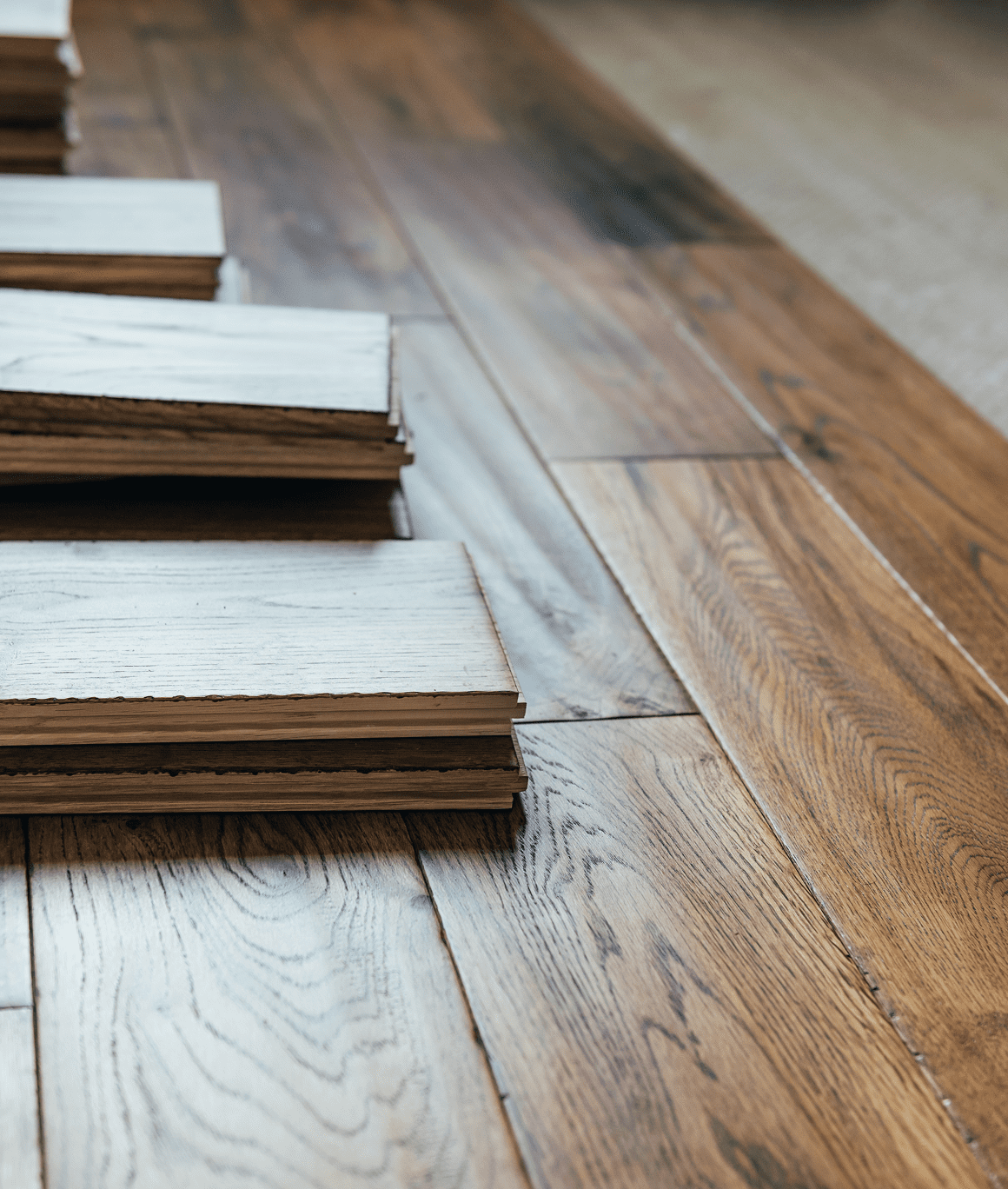 Piles of wooden panels on floor.